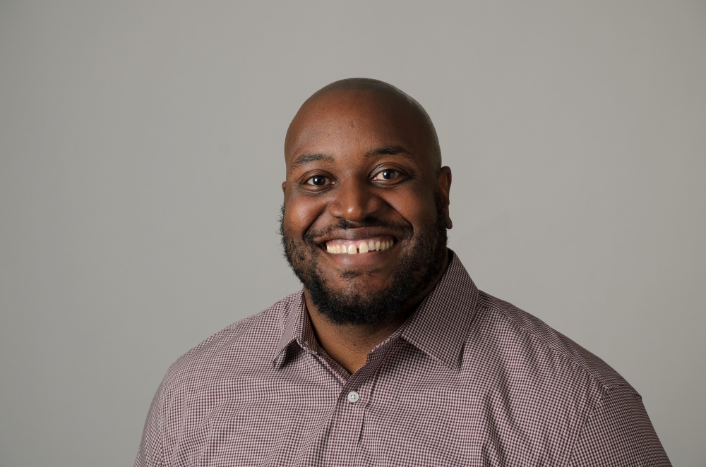 Portrait of Tristan White wearing a collared shirt.